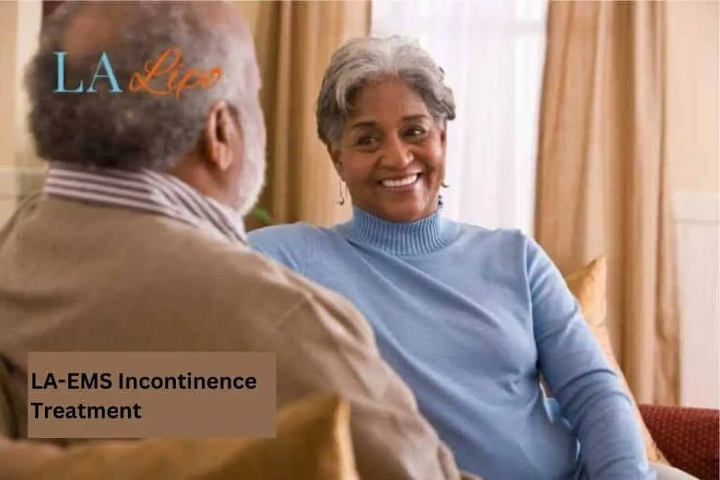 Couple sat smiling at each other - LA-EMS treatment Suffolk