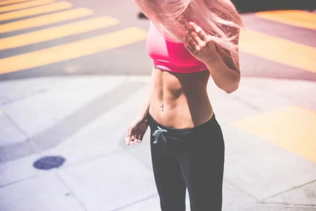 Woman with toned stomach after LA-EMS Body Sculpting Treatment Suffolk
